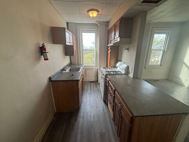 Building Photo - Updated flooring, finished basement, and g...