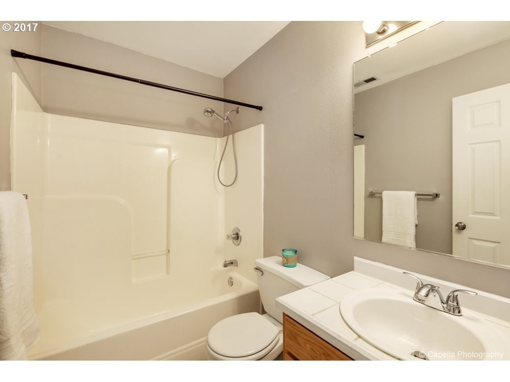 Second full bathroom on the upper floor with bath- tub and vanity - 7414 NE Shaleen St