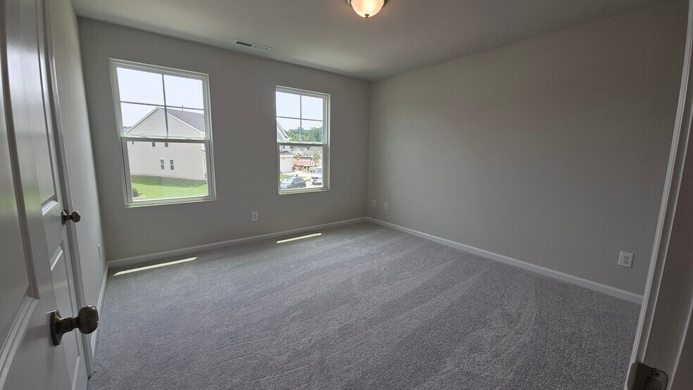 Right-side bedroom view (Shades have since been installed!) - 2207 Cape May Ln