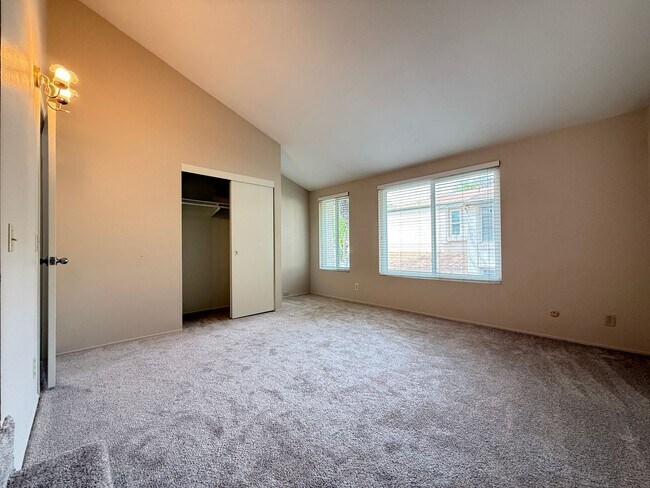 Building Photo - Move in Ready! 2BD Townhome! New Carpet! Two Patio Spaces! Attached Garage!