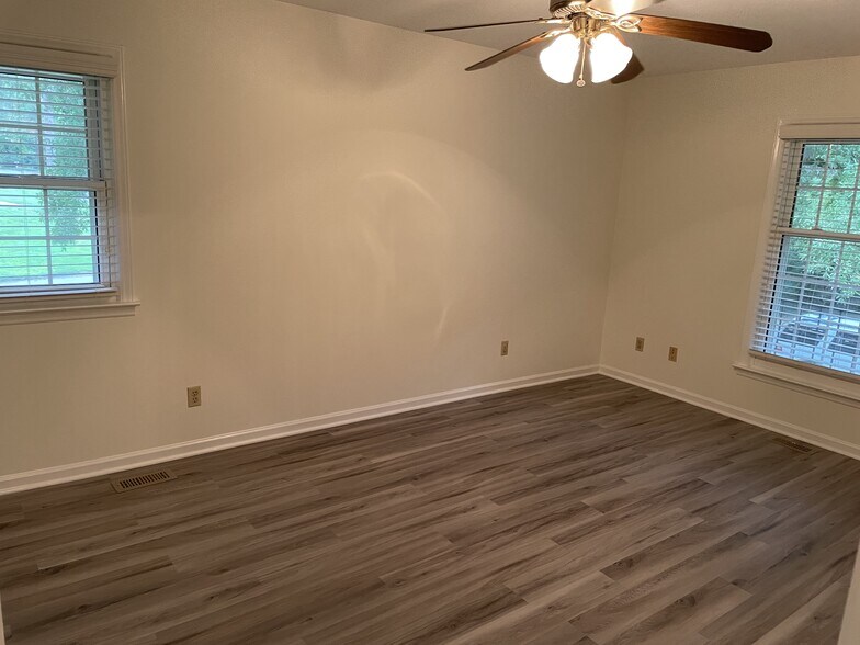 Primary suite has two closets, plentiful natural light - 419 Sharon Rd