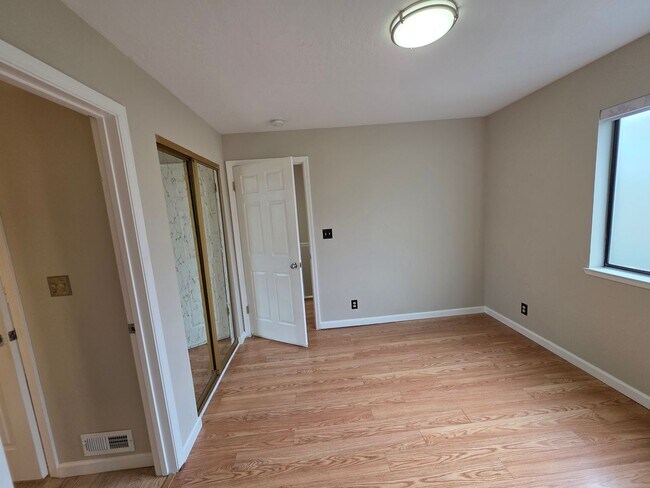 Building Photo - Spacious 2BR Condo with Central A/C, Bonus Room & Huge Storage – Walk to Burlingame Avenue