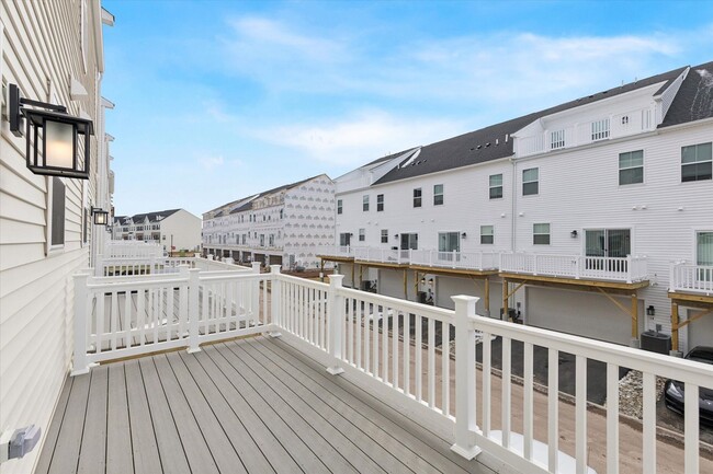 Building Photo - COMING SOON! Brand New River Pointe townhome with modern finishes, flexible living space, and a p...