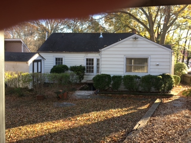 rear of house with shedf and steps lead dowm to unfinished basement for storage - 731 Berkeley Ave NW