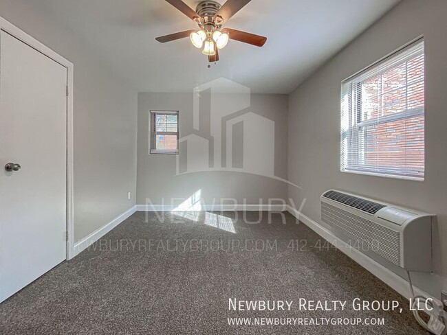 Building Photo - Modern One-Bedroom Apartment in Port Vue: ...