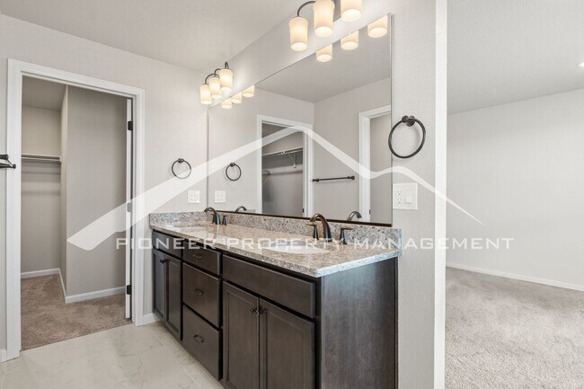 Building Photo - Contemporary Townhome in the Vibrant Interquest Low Maintenance Community with 2 car garage, Wash...