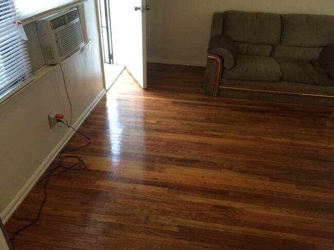 main living area showing genuine hardwood floors - 5646 Farmdale Ave