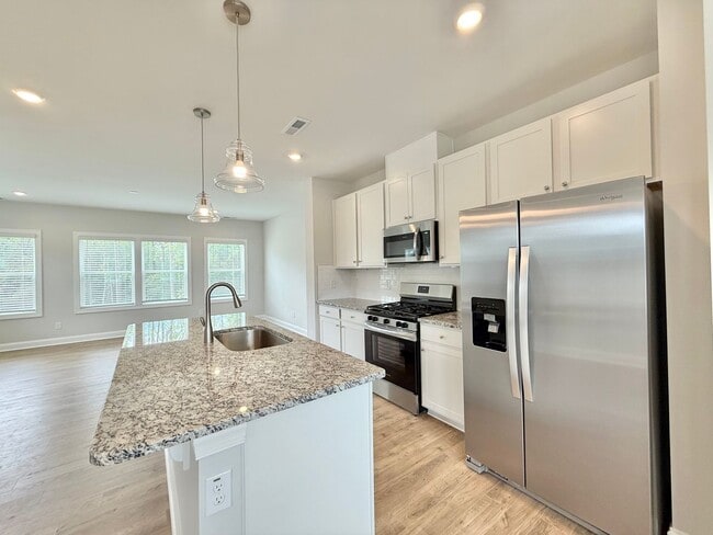 Building Photo - Stunning End Unit New Construction 3BD, 3....