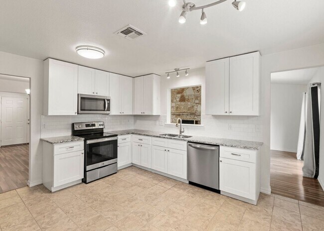 Building Photo - Move-In Ready Contemporary Gem on Treed Co...