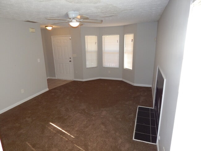 Building Photo - Freshly painted and new flooring in this 4 Bedroom 2 and Half Bath home. Covered front porch with...