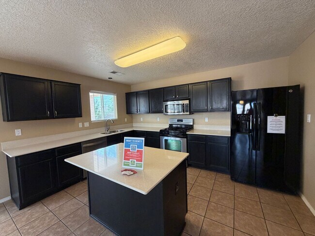 Building Photo - 4 Bedroom Home Available Near McMahon Blvd NW & Universe Blvd NW!