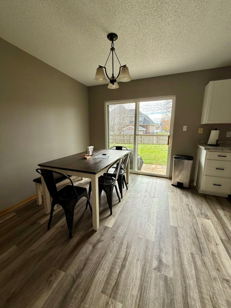Kitchen / Dining with view of fenced in backyard - 3006 SW Glenbrooke Blvd