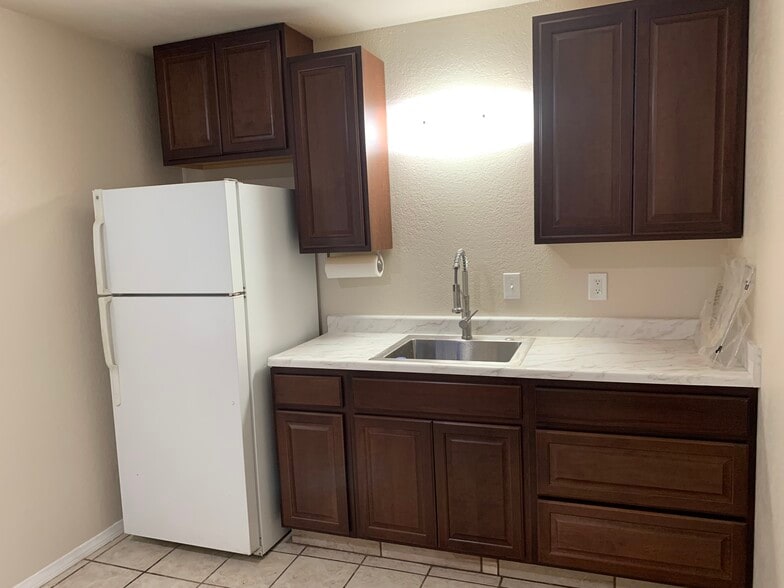 Kitchen with refrigerator - 636 Commercial Ave