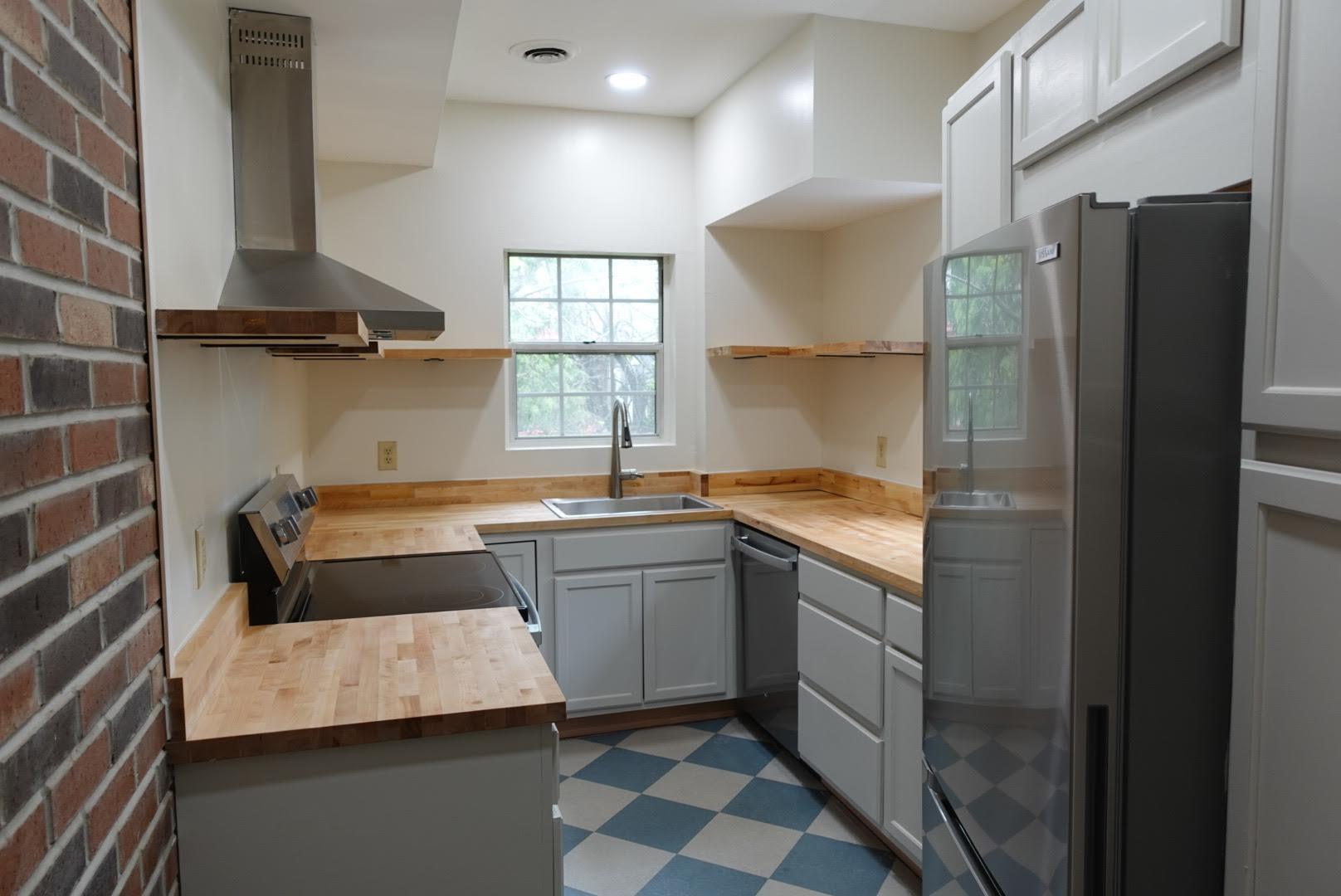 New cabinets, appliances, countertops and sinks make a charming and inviting cooking space - 327 Hudson Ave
