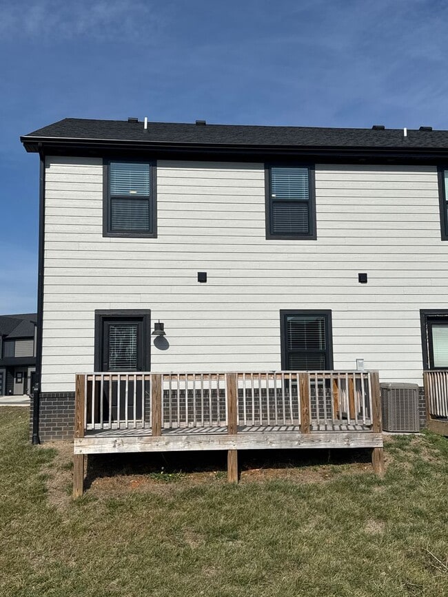 Building Photo - “Stylish 3BR End-Unit | Open Concept | Quartz Kitchen | Garage + Deck