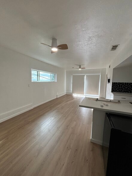 Newly renovated living room & kitchen - 3051 Malcolm Ave