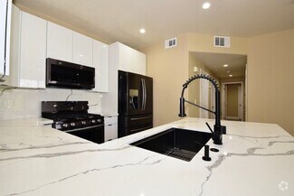 Building Photo - SPECIOUS 2 BED 2 BATH CONDO WITH ATTACHED ...
