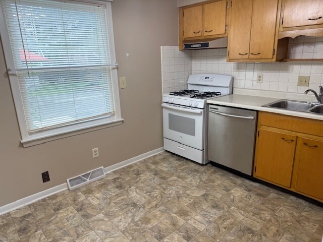 Like unit. Unit available has white kitchen cabinets. - 1118 E Washington St
