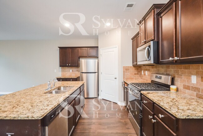 Building Photo - Don't miss out on this lovely 4BR 2BA home