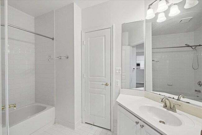 Building Photo - Commuter’s Paradise! Ground-Level 2BR Condo  Welcome home to this stunning, sun-filled 2-bedroom ...