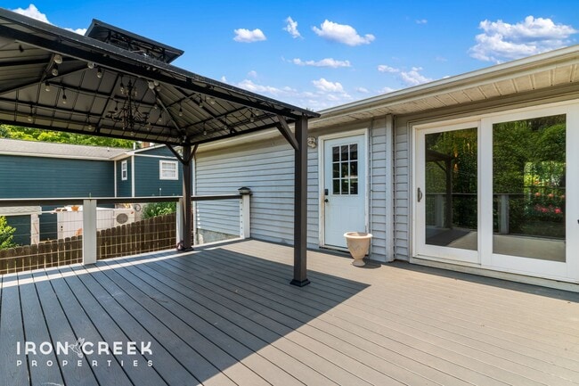 Building Photo - Beautifully Updated Three-Bedroom with Koi...