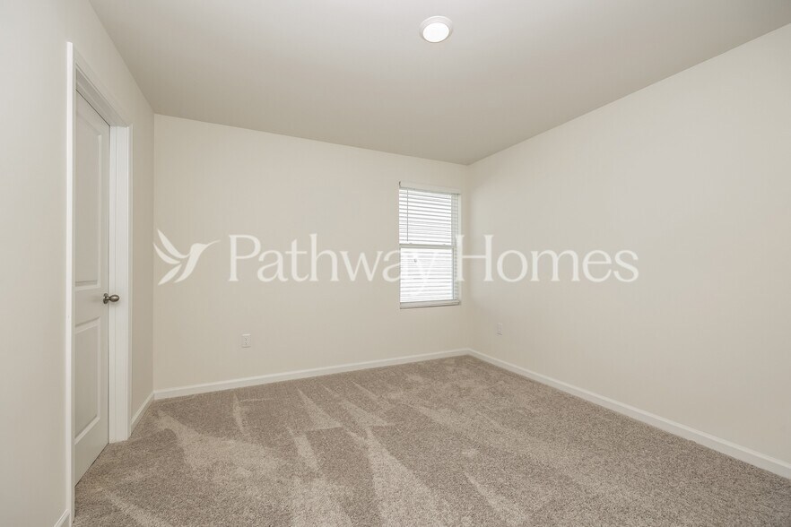 Building Photo - 202 Wild Daisy Wy