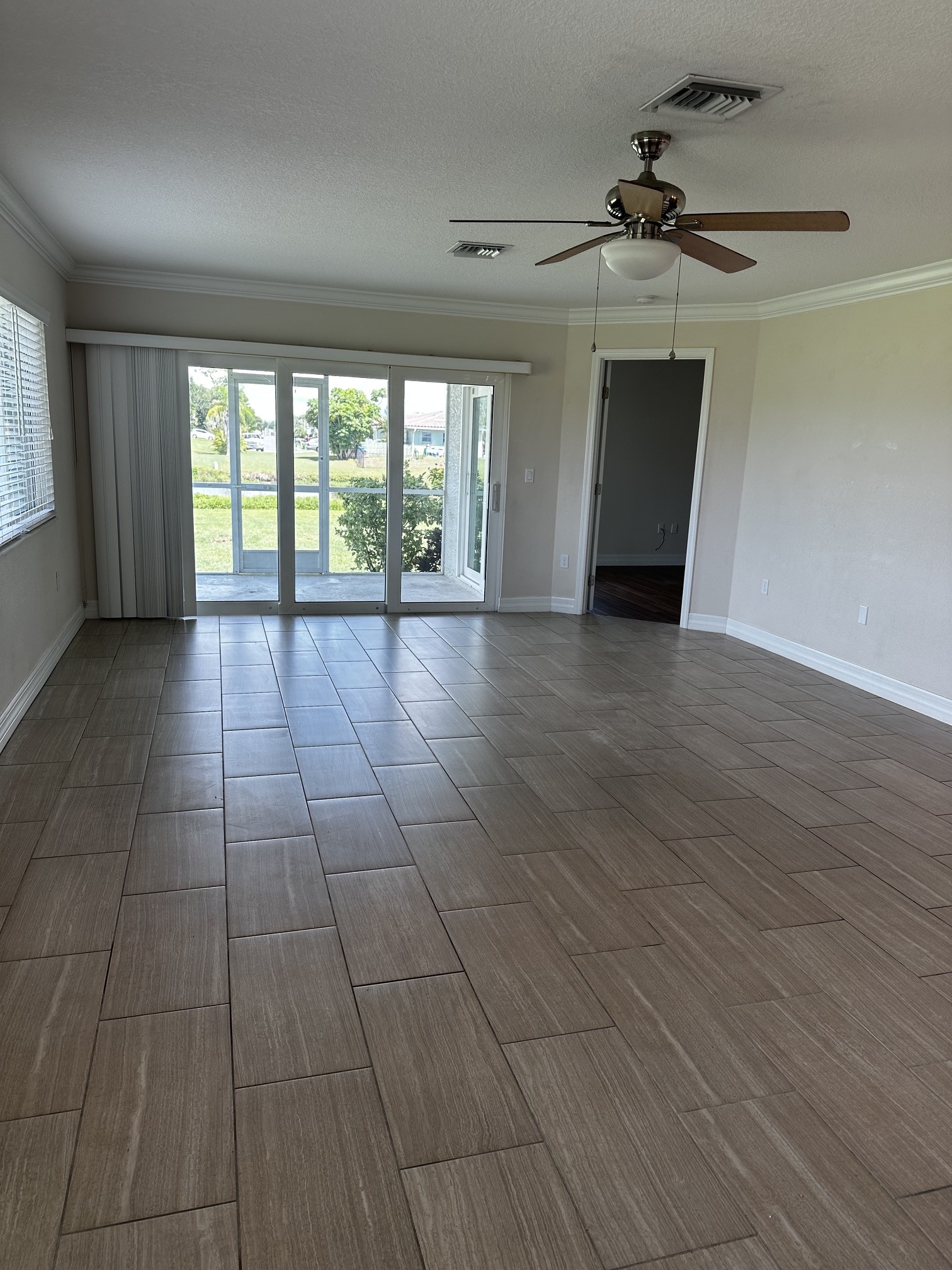 Great room with celing fan and crown molding - 190 Boundary Blvd