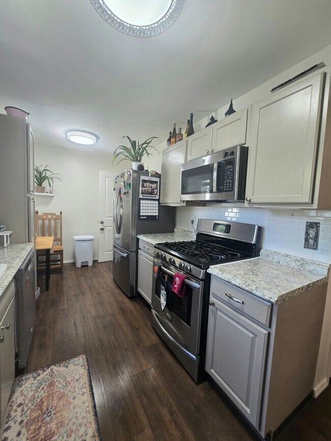 Building Photo - Spacious 4 Bedroom Home with Fenced Yard +...