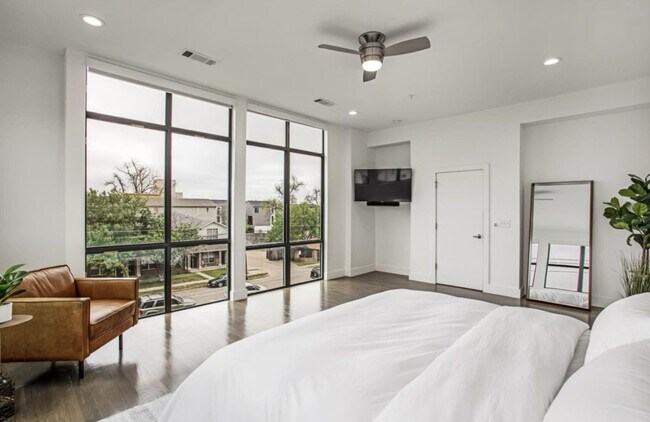 Windows have remote controlled electric window shades - 2307 N Carroll Ave