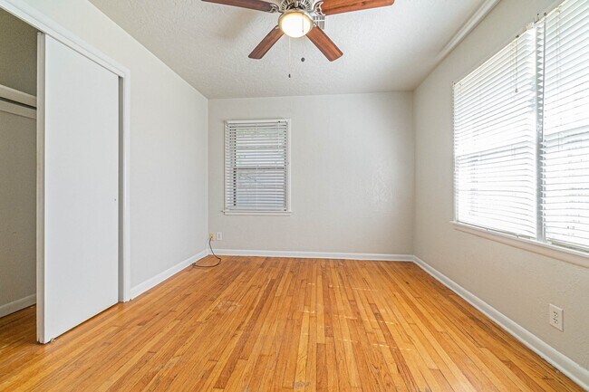 Building Photo - Three Bedroom Home in tree filled neighborhood! Lawn care included!