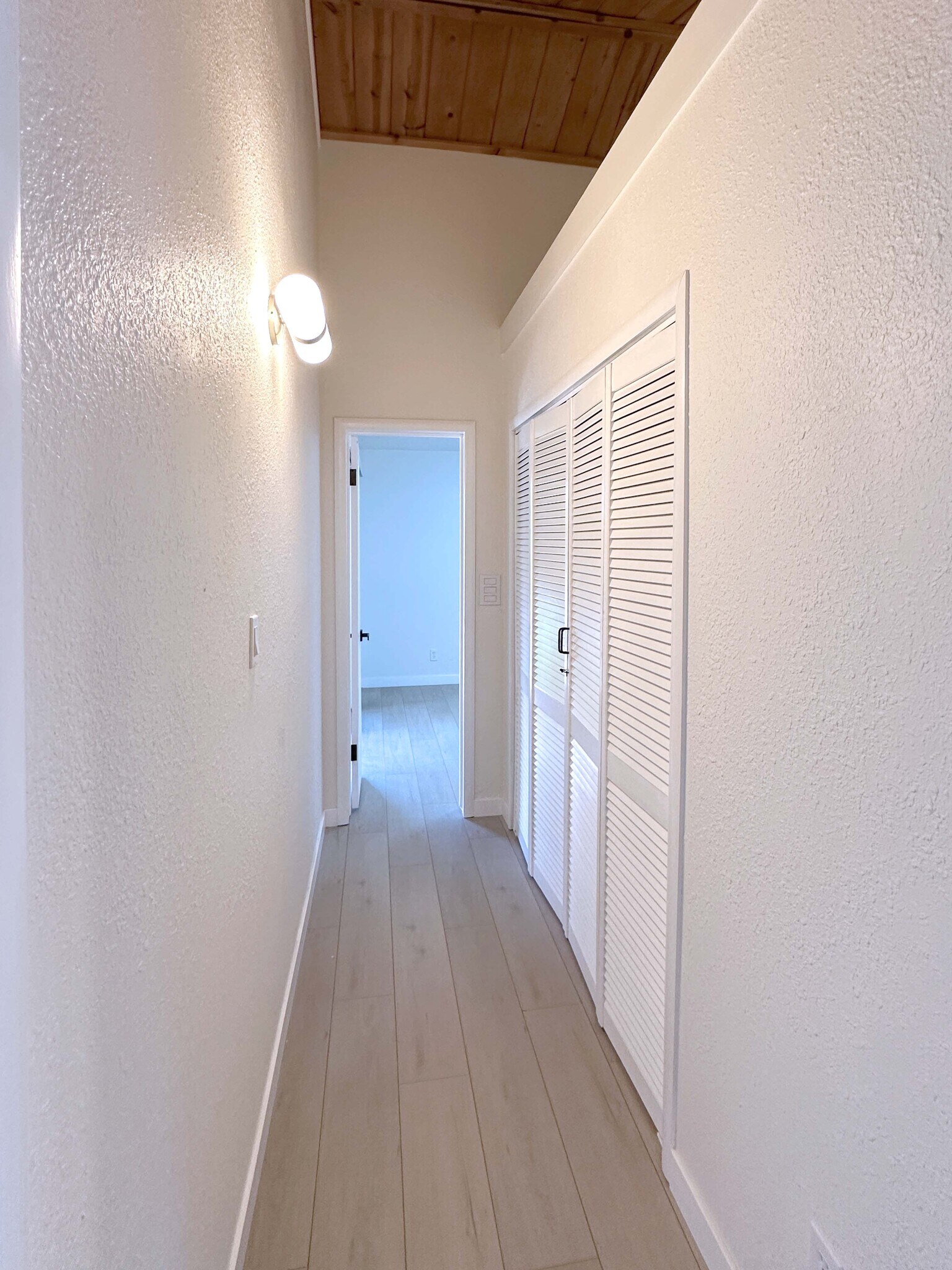 Functional laundry space tucked in the hallway for easy access. - 4570 58th St