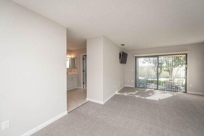 Building Photo - Welcome to this spacious three-bedroom, three-bath home in the heart of Palm Bay