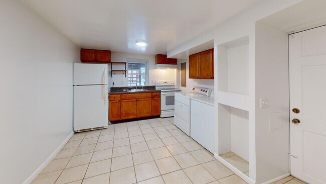 Building Photo - Four Bedroom 2,500 Square Foot House W/Back Patio, Multiple Kitchens/Laundry Facilities