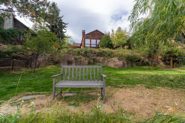 Building Photo - Private river access and stunning views from this home on Harmon Blvd! + Bonus Room