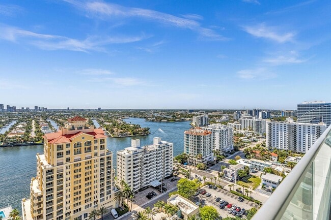 Building Photo - Stunning High-Rise Condo with Ocean Views | Prime Beach Location
