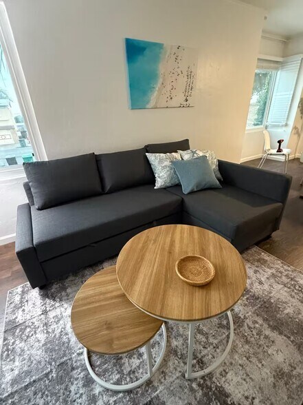 Furnished with queen sleeper sofa with storage chaise. - 312 Rosecrans St
