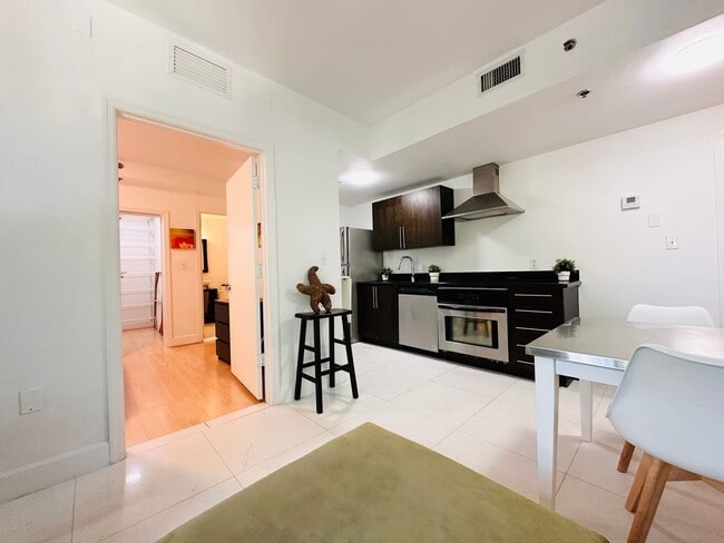 Building Photo - Bright and furnished 1/1 in classy remodel...