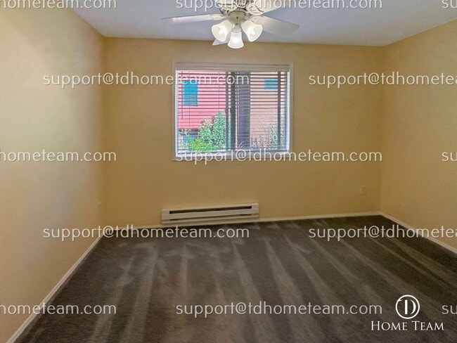 Building Photo - "Charming 2-Bed Townhouse with Gleaming Hardwood Floors in Vibrant Seattle Neighborhood"