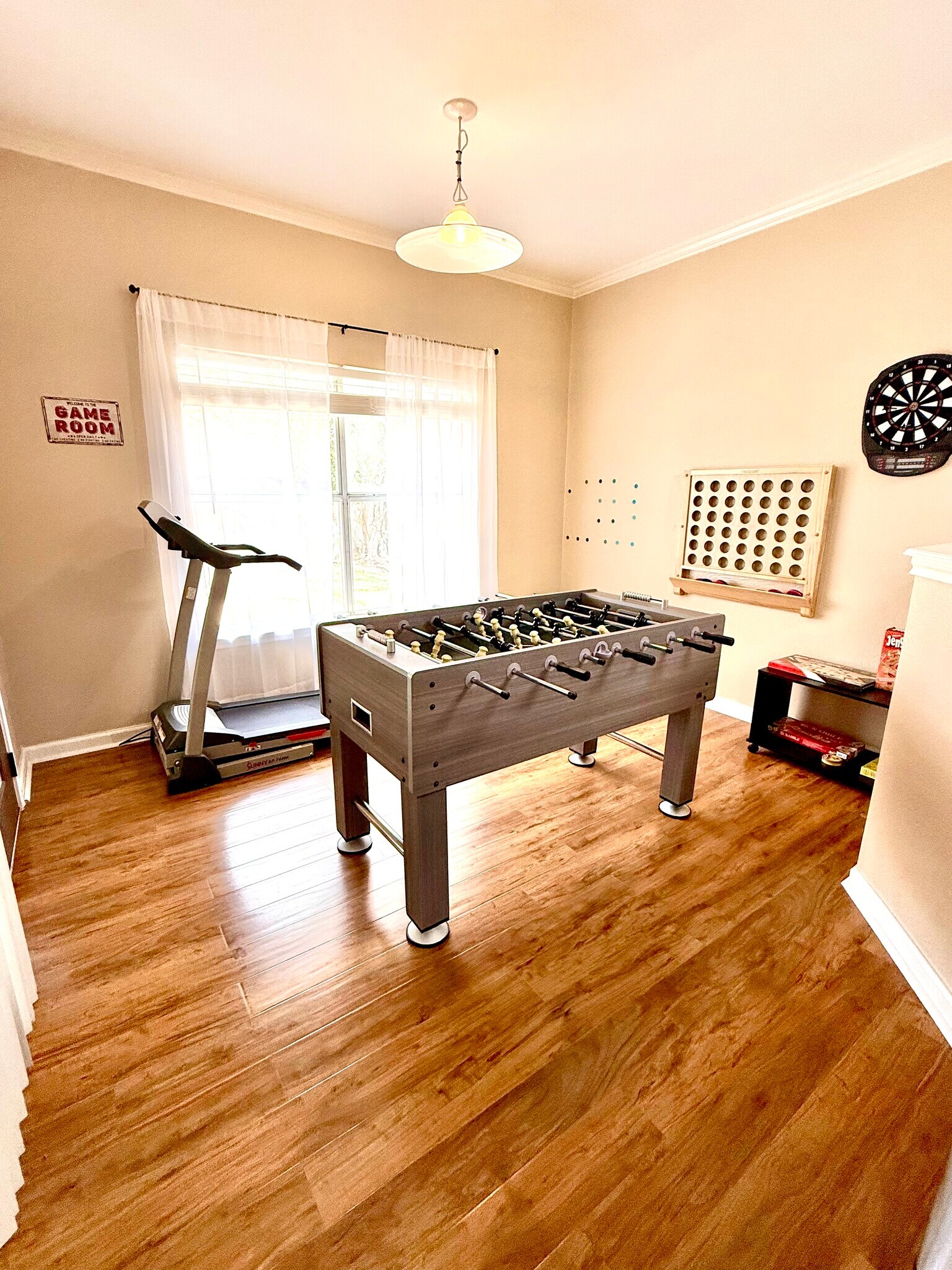 game room with foosball, connect4, boardgames, and treadmill - 9163 Timber Rnch