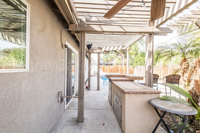 Building Photo - 3 Bedroom/2 Bath with a Pool and Solar - $...