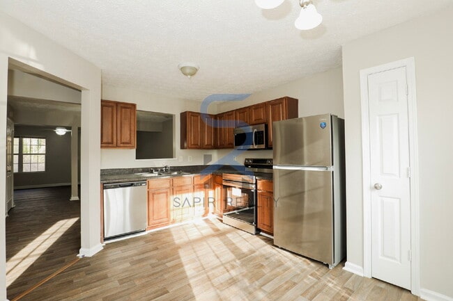 Building Photo - Move in before February 28th and choose your reward: a $250 Amazon Gift Card or a 55" Smart TV!