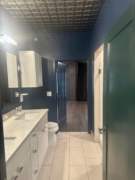 Bathroom has 2 sinks and a shower. - 4361 S Congress Ave