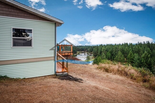 Building Photo - Post Falls Riverfront Home!