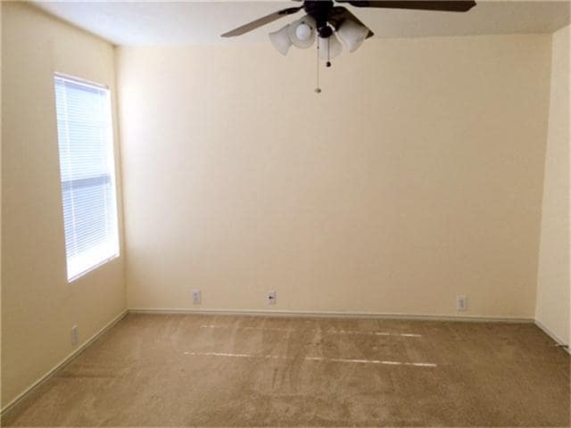 Large second master bedroom overlooking backyard. - 23619 Twisting Falls Drive