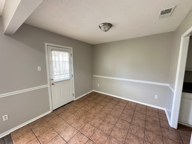 Building Photo - Charming 3BR/2BA Near Southwind | Soaring Vaulted Ceilings, Rustic Fireplace & Garage