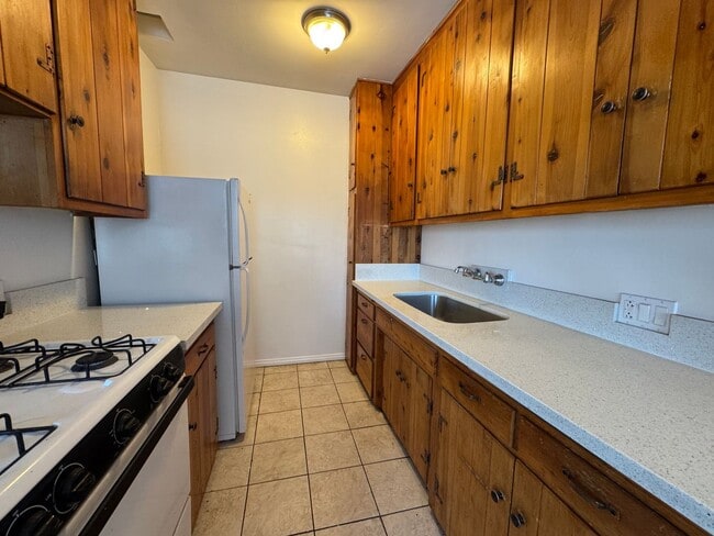 Building Photo - Large and Bright Studio with wood ceiling beams and floors...