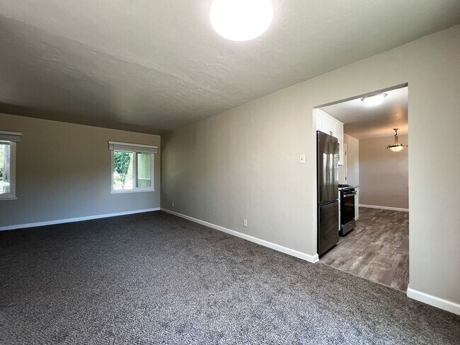 Building Photo - Freshly Renovated 3 Bedroom Home with Large Fenced Yard & Double Garage