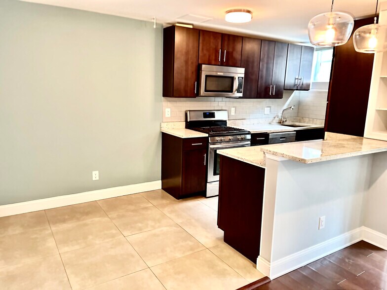 Open concept kitchen, dining area, and living area - 2339 40th Pl NW