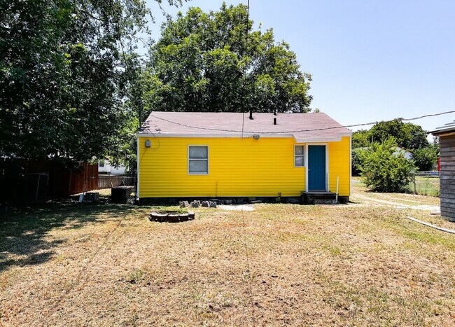 Building Photo - The Happy Yellow House