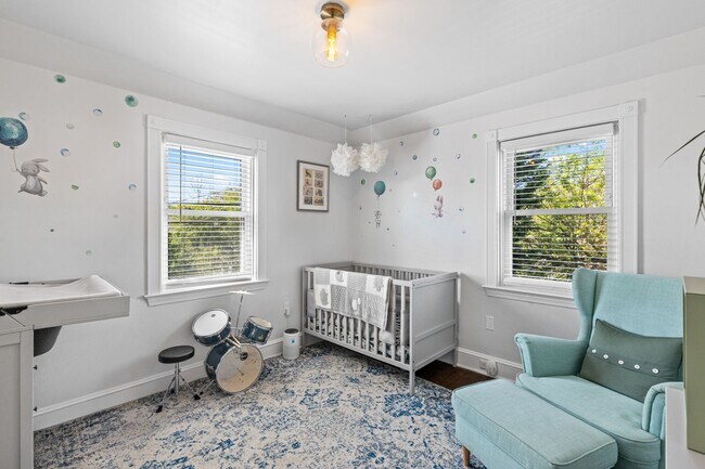 Building Photo - Luxurious Brick Colonial in Prestigious Gu...